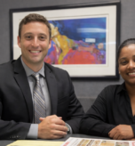 Greg Lipsit, owner of TaxGlad sitting next to woman in office